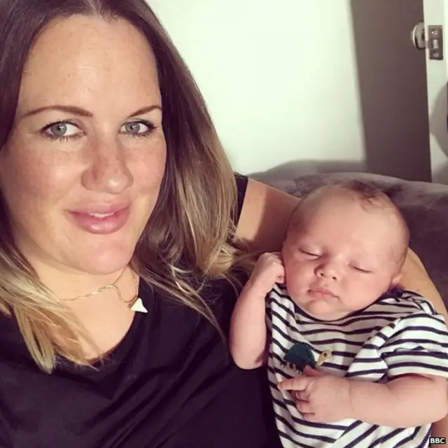 Robyn holding her newborn son Teddy