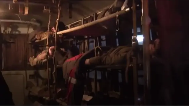 বাসের মধ্যে আহত সৈন্যরা