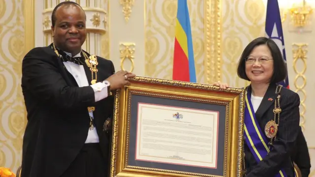 Swaziland absolute Monarch King Mswati III (L) poses with Taiwan President Tsai Ing-wen (R) after awarding her with the Order of the Elephant during her visit to the Kingdom of Swaziland at an official ceremony on April 18, 2018 in Lozitha Palace, Manzini.