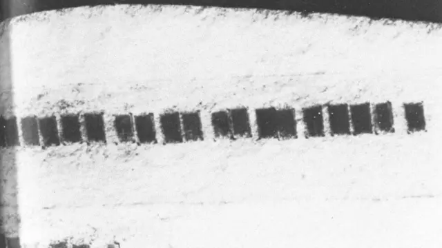 Microdots taped inside the label of an envelope sent by German spies in Mexico City to Lisbon during World War Two