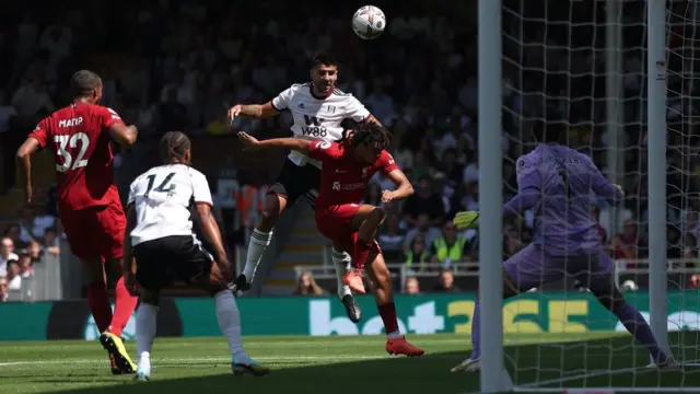 Aleksandar Mitrovic (centre) scores for Fulham