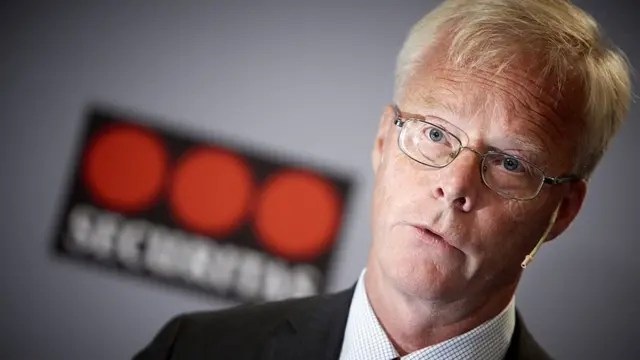 Alf Göransson e um logo da Securitas