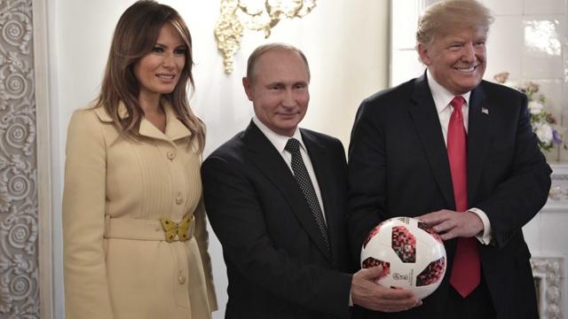 Putin, and the Trumps with a World Cup ball
