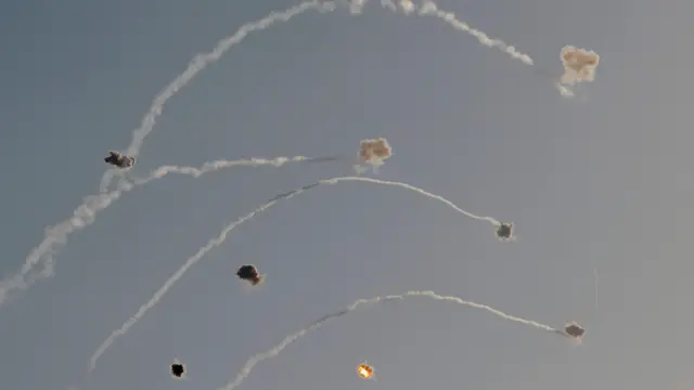Rockets being intercepted in the sky