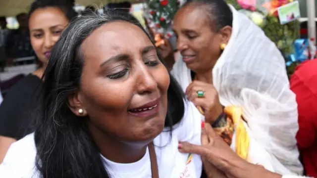 Senait Zaro, reacts as she meets her family for the first time in fifteen years, at Asmara International Airport, who arrived aboard the Ethiopian Airlines ET314 flight in Asmara, Eritrea July 18, 2018