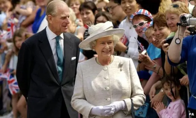 Queen Elizabeth II and the Duke of Edinburgh greet crowds in the grounds of Windsor Castle, Berkshire, 2002