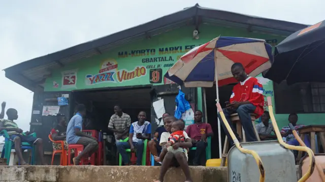 People outside a shop