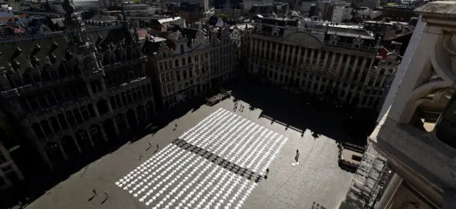 Cooking jackets are displayed as part of a protest by restaurant workers demanding more help from the government in Brussels