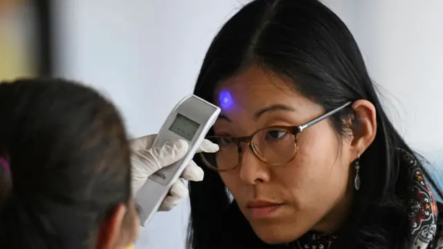 Woman being screened at Guatemala airport