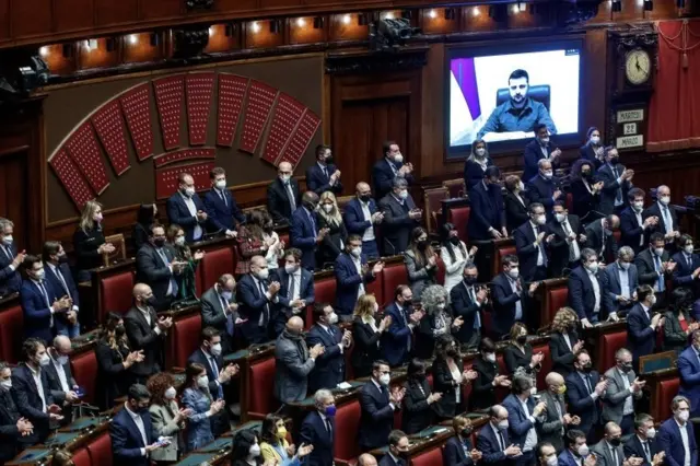 Ukrainian President Volodymyr Zelensky (on screen) addresses members of the Italian Parliament via video conference during an extraordinary Plenary session debating on the "Russian aggression against Ukraine", at the Italian Parliament in Rome, Italy, 22 March 2022.