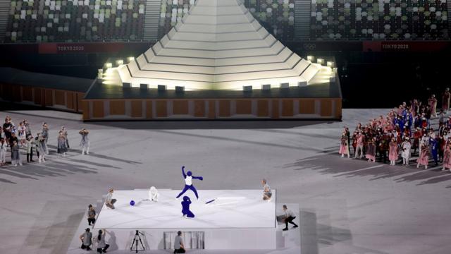 A performer dressed as a Pictogram acts out differnet Pictograms during the Opening Ceremony of the Tokyo 2020 Olympic Games at Olympic Stadium on July 23, 2021 in Tokyo, Japan.