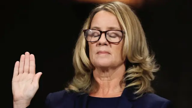 Christine Blasey Ford closes her eyes as she is sworn in before testifying to the Senate Judiciary Committee confirmation hearing for President Donald Trump"s Supreme Court nominee Judge Brett Kavanaugh on Capitol Hill in Washington, U.S., September 27, 2018.