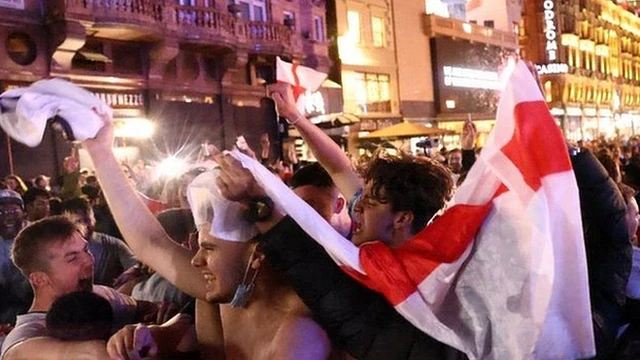 England fans celebrate victory over Ukraine in London's Leicester Square