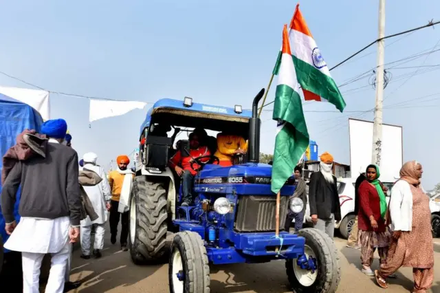 Farmers with his tractor arrive for enter in the capital for Tractor Republic Day parade rally during their farmers' ongoing agitation over the new farm laws, at Singhu border on January 25, 2021.