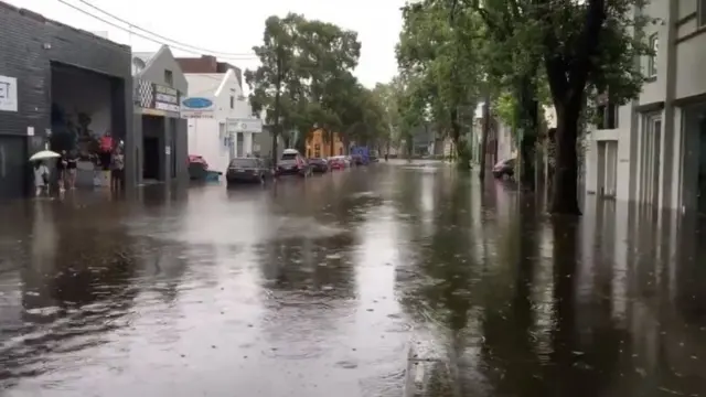 A street is seen completely covered by water