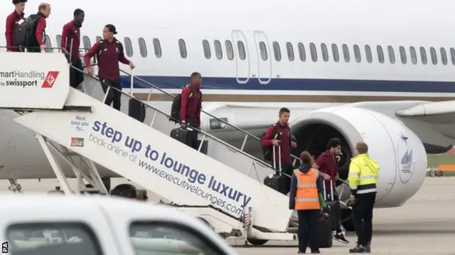 Liverpool players arrive back at John Lennon airport