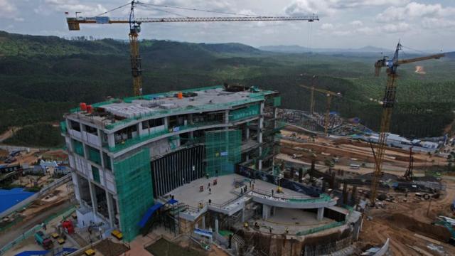 Cranes tower over the landscape as Nusantara is built