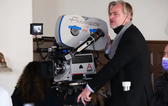 Christopher Nolan on the set of Oppenheimer, was hailed as 'a genius' by Cillian Murphy