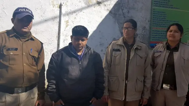 Krishna Sen accompanied by police officers