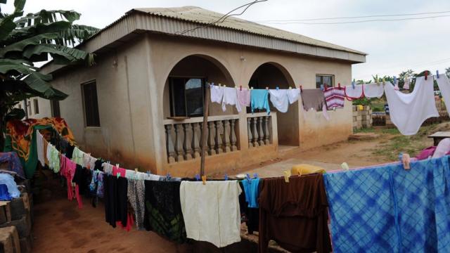 Clothes hang outside pesin bungalow house.