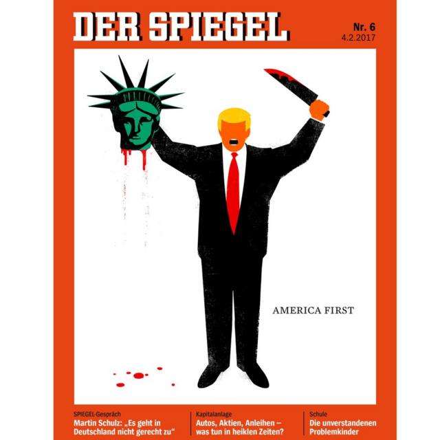 La portada de la revista Der Spiegel muestra una caricatura de Donald Trump con un traje, sin nariz ni ojos, sosteniendo la cabeza cortada de la Estatua de la Libertad en la mano derecha y un gran cuchillo ensangrentado en la mano izquierda. Escrito junto con las palabras: America First (Primero Estados Unidos).