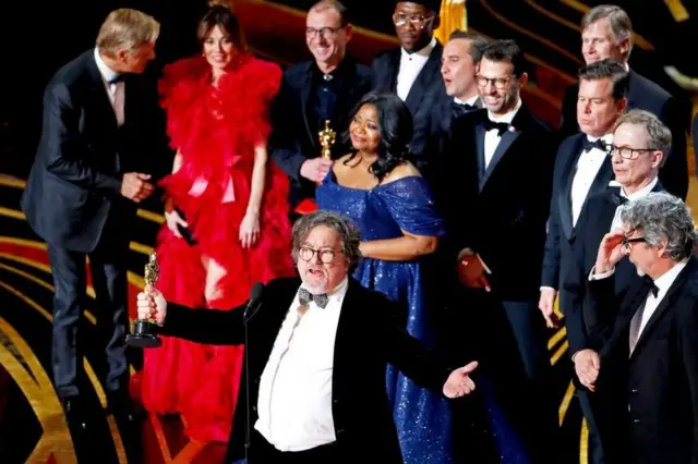 Green Book producer Charles Wessler spoke on stage alongside director Peter Farrelly (right) and cast and crew after the film won the top award, best picture