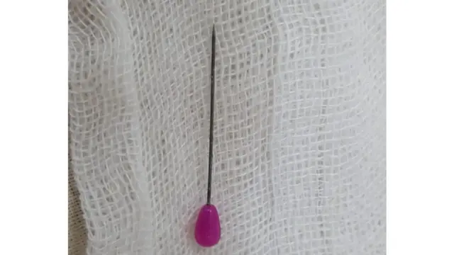 গলায় আটকে যাওয়া এই হিজাব পিনটি বের করেছিলেন ডা. নুরুল হুদা নাঈম।