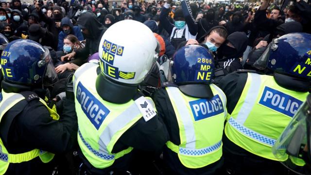 Demonstrators clash with police officers during a Black Lives Matter protest,