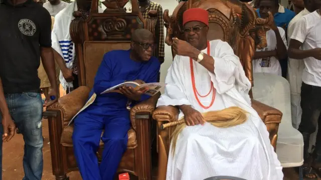 Obi of Onitsha, Alfred Nnaemeka Achebe and his aide