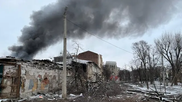Smoke billows from a damaged building in Kharkiv