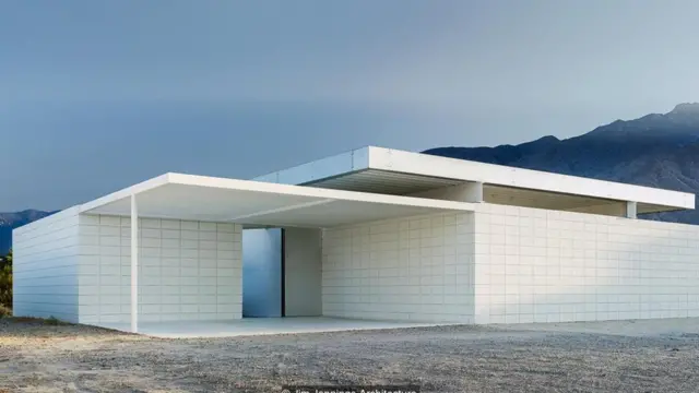 Ukuta wa nyumba hii uliojengwa na saruji unakupatia madhari ya kisasa ya uwazi wa jangwa