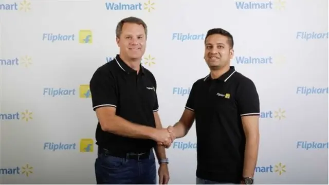 Flipkart co-founder and chief executive Binny Bansal (right) with Walmart chief Doug McMillon