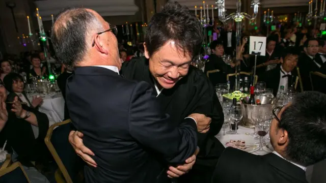 Karashi (right) celebrates his victory in the 2015 International Wine Challenge