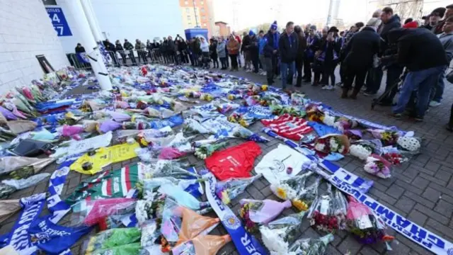 Fans gathered at the King Power Stadium to leave flowers and pay their respects