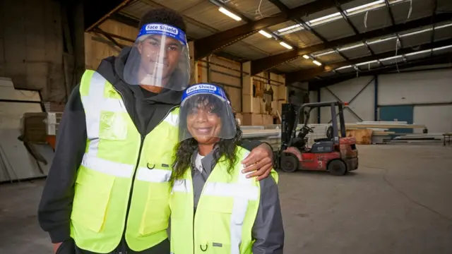 Rashford and his mum during a visit to the Greater Manchester chapter of charity FareShare, which is naming a new warehouse in honour of his mother Melanie, on 23 October