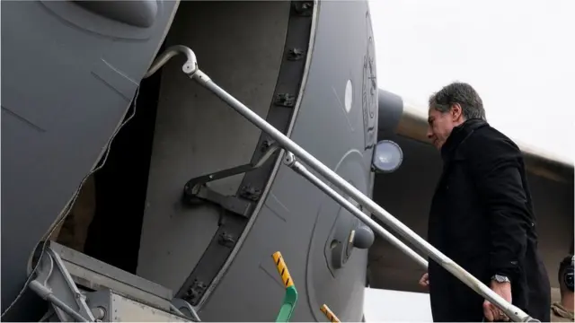 Secretary of State Antony Blinken boards a plane for departure, April 23, 2022