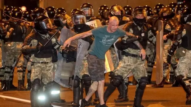 Riot police detain a protester in Minsk, Belarus. Photo: 9 August 2020