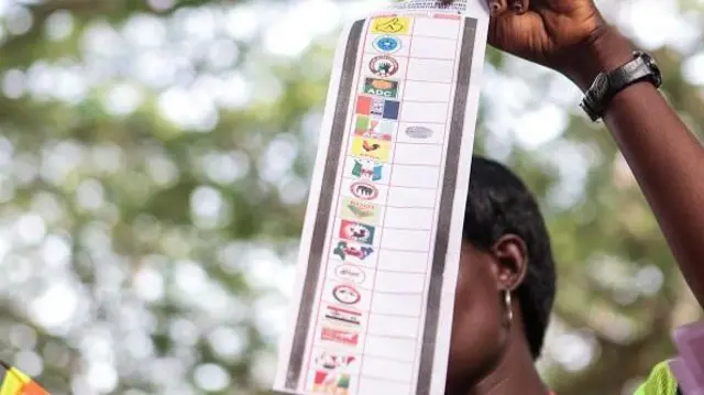 Woman hold ballot paper during Nigeria election