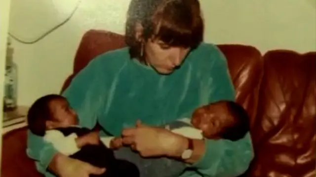 Nimal Samantha (R) with his twin brother, Djoeri Sanjeewa, and their adopted mother