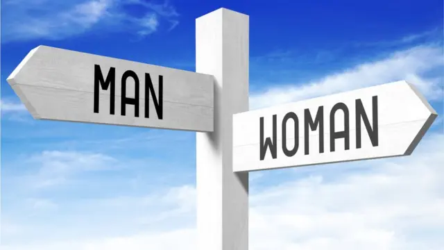 Placa encaminhando homens e mulheres para caminhos diferentes