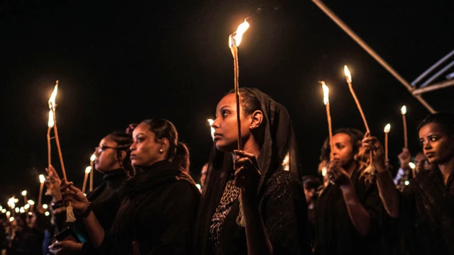 Relatives and colleagues of those who died in the Ethiopian Airlines 737 Max crash hold candles at a ceremony in southern Ethiopia - Monday Tuesday 10 March 2020