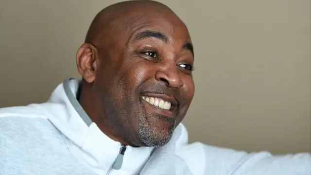 Darren Campbell, pictured in 2018, at home recovering after suffering a bleed on the brain. It left him "relieved to be alive"