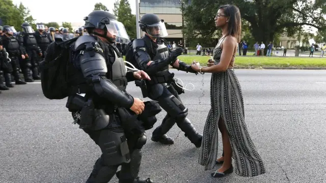Iesha Evans stand sup to police lines