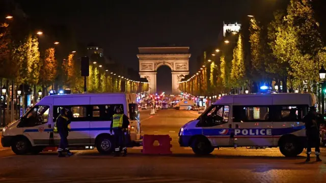Police secure the area after a gunman opened fire on Champs Elysees in Paris, 20 April 2017