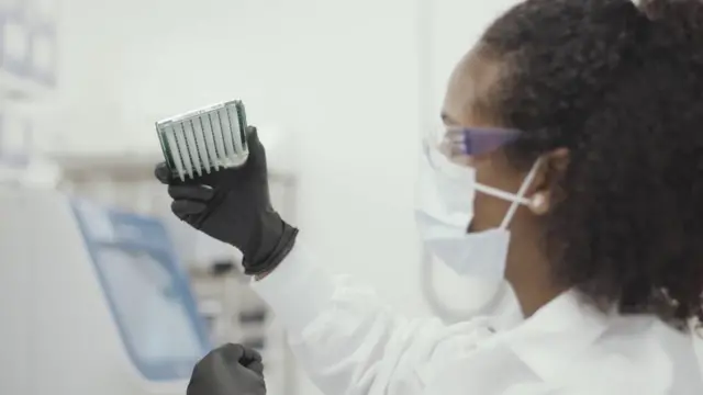 Scientists work on the Moderna coronavirus vaccine