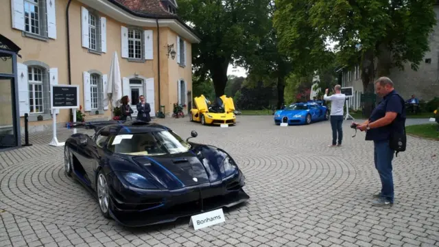 Dem display di luxury cars for di auction for di Swiss village of Cheserex, near Geneva