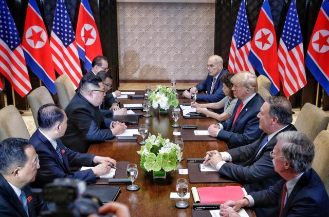 U.S. President Donald Trump meets with North Korean leader Kim Jong Un at the Capella Hotel on Sentosa island in Singapore June 12, 2018. Kevin Lim/The Straits Times