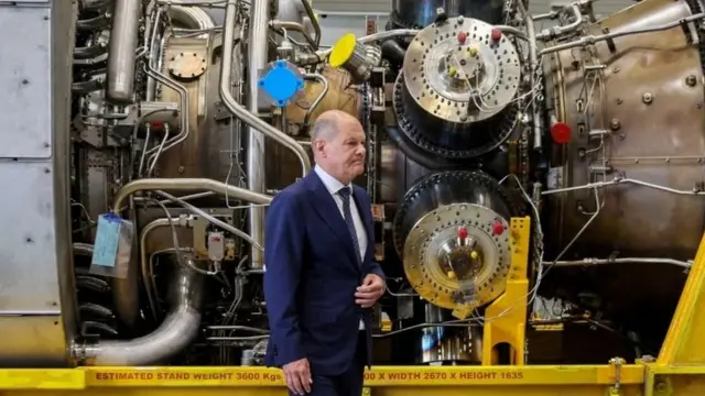 German Chancellor Olaf Scholz beside turbine for Nord Stream gas pipeline - 3 August