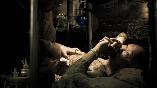 A man getting tattooed