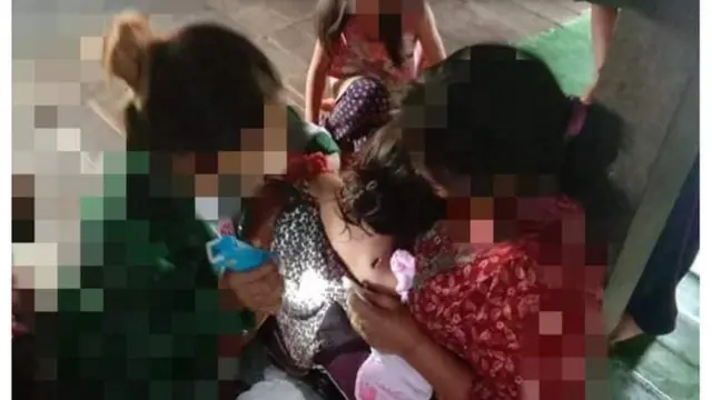 အသက် ၁၀ နှစ်ဝန်းကျင် ကလေး လည်ပင်းကျည်ထိမှန်ထား